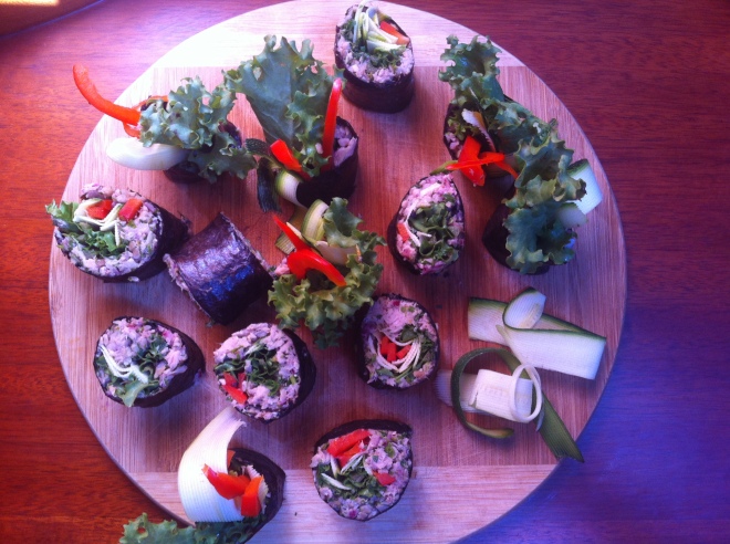 Sushi with crushed sunflower paste, fresh herbs and raw vegetables. 